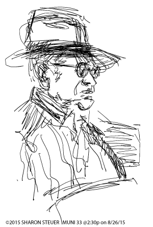 Man with Hat and Glasses on Muni (profile)